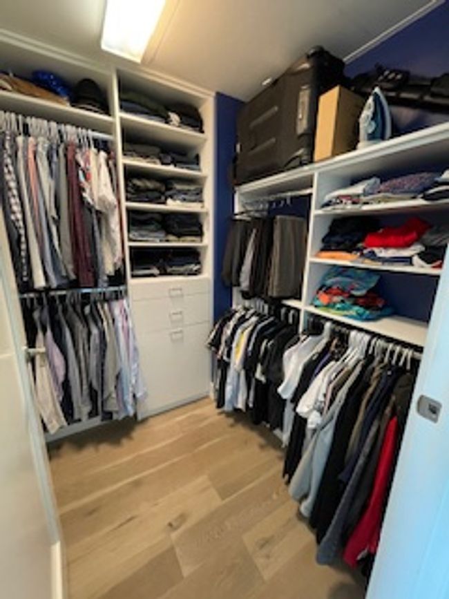 Spacious closet featuring light wood finished floors | Image 5