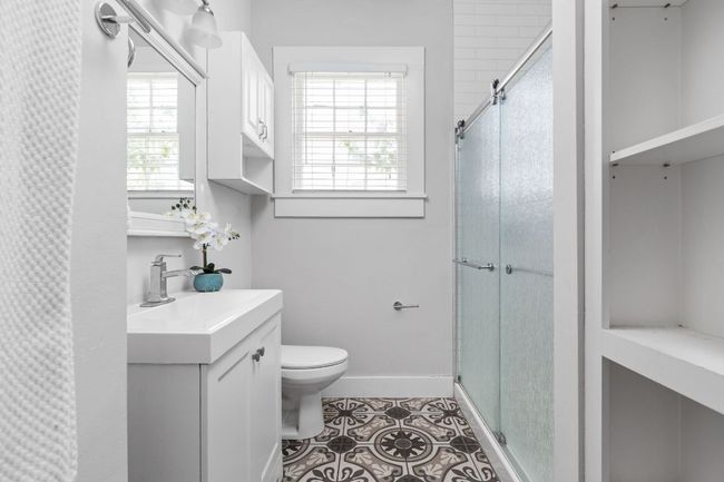 Full bath with a shower stall, vanity, baseboards, and​​‌​​​​‌​​‌‌​‌‌​​​‌‌​​‌‌​‌​​​​​‌ toilet | Image 16