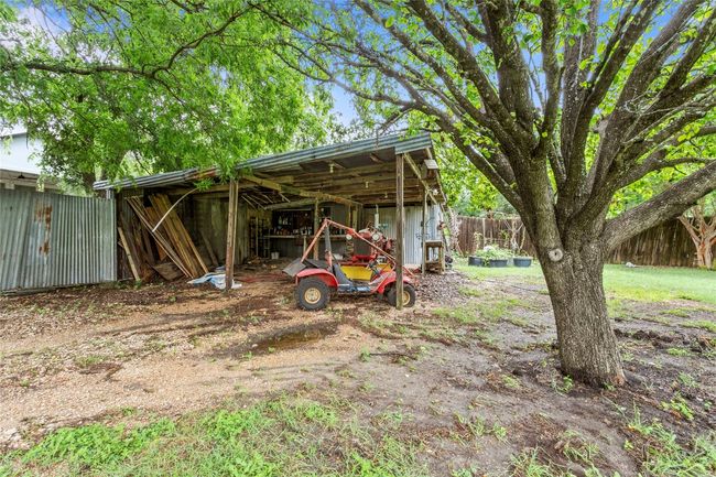 View of yard featuring an outbuilding and an outdoor structure | Image 33