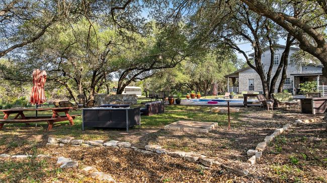 View of yard with an outdoor pool | Image 36