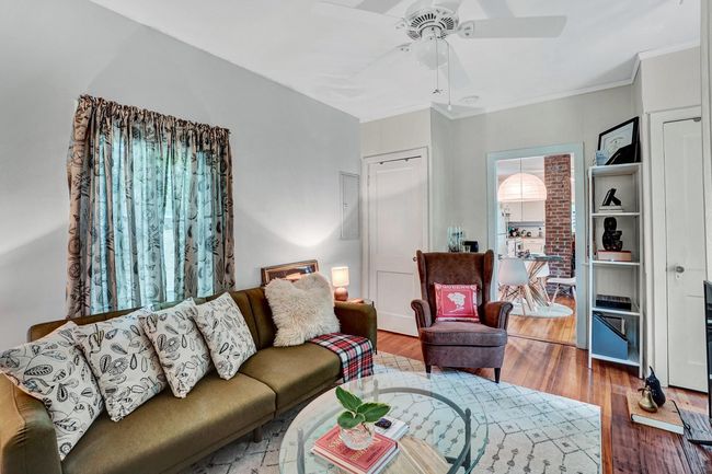 Living area featuring ornamental molding, wood finished floors, and ceiling fan | Image 9