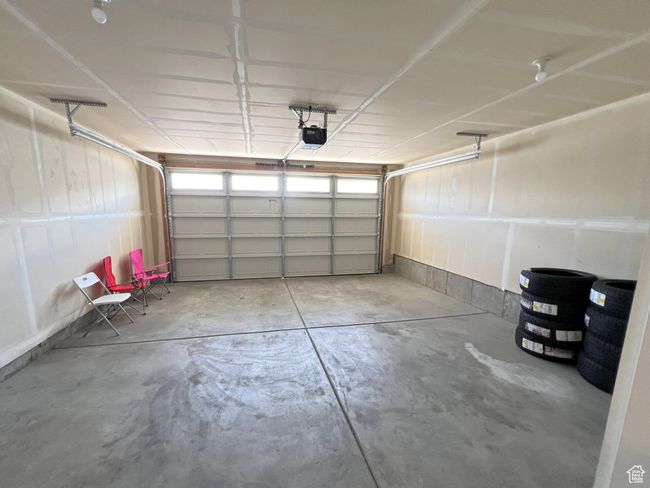 Garage featuring a garage door opener | Image 8