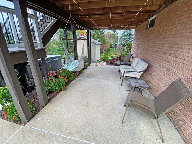 Rear patio under the deck. | Image 26
