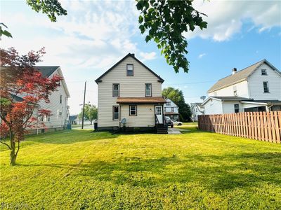 Back of property featuring an oversized yard w/ huge mature Japanese maple!$$$ | Image 2