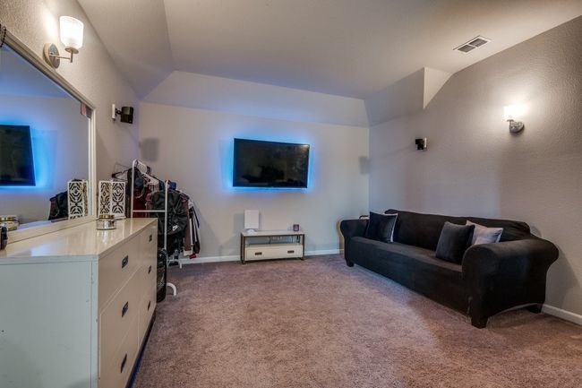 Upstairs media room that is currently a bedroom | Image 19
