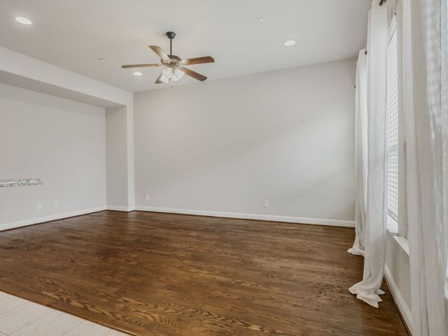 Spare room with a ceiling fan, recessed lighting, and wood finished floors | Image 13