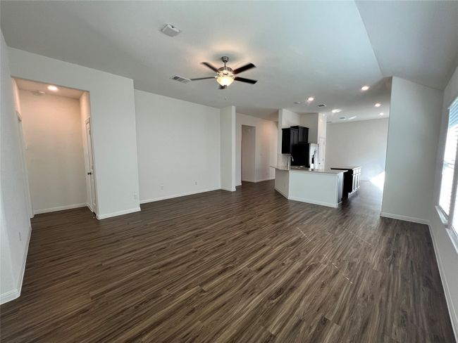Unfurnished living room with recessed lighting, dark wood finished floors, and ceiling fan | Image 18