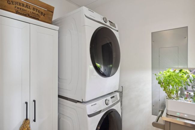 Laundry room featuring stacked washer / dryer | Image 29