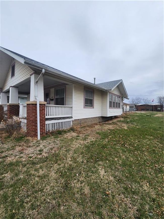 View of property exterior with a yard | Image 5