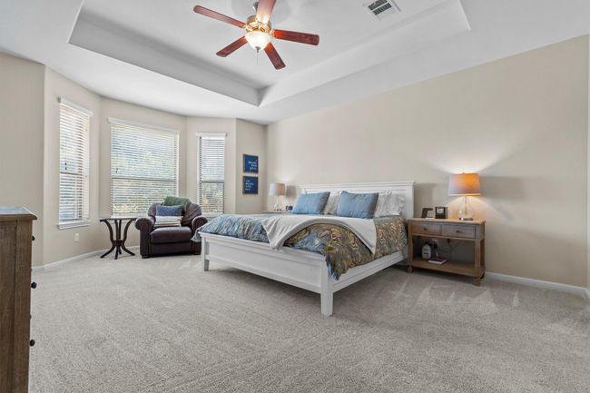Graciously scaled and filled with light, the primary bedroom offers peaceful seclusion and space to unwind. | Image 20