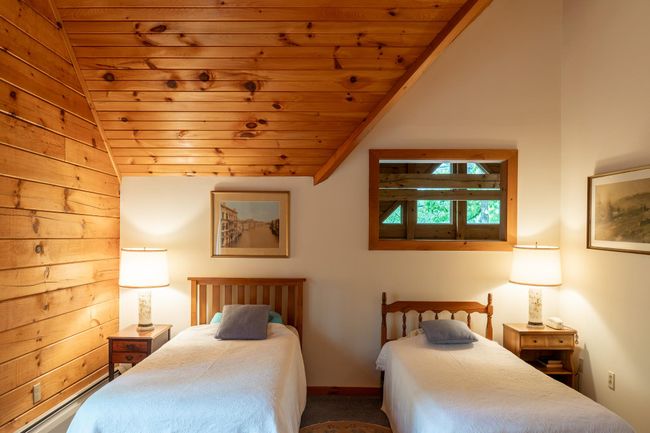 Carpeted bedroom with vaulted ceiling and wooden ceiling | Image 20