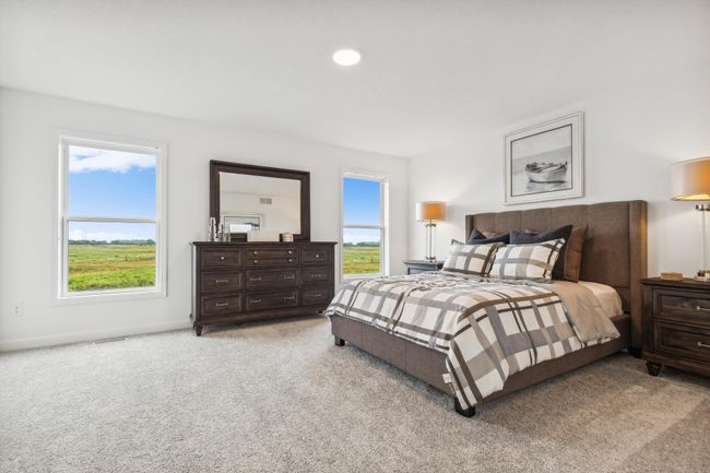 (Photo of a decorated model, actual homes finishes will vary) Find your retreat in this stunning primary bedroom. Enjoy the exclusivity of a private bath and huge walk-in closet. | Image 14
