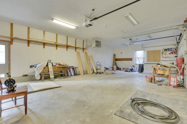 This has service door to outside and entrance to each laundry room | Image 64