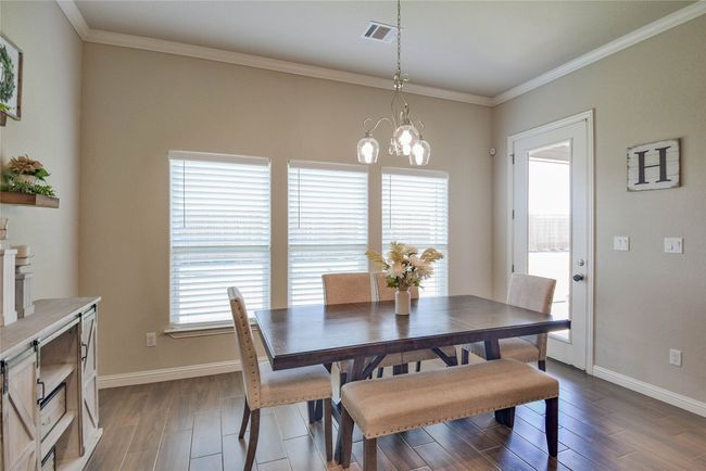 Dining area featuring wood finished floors | Image 17