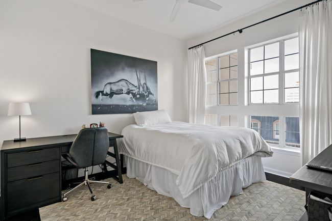 Bedroom featuring ceiling fan | Image 18