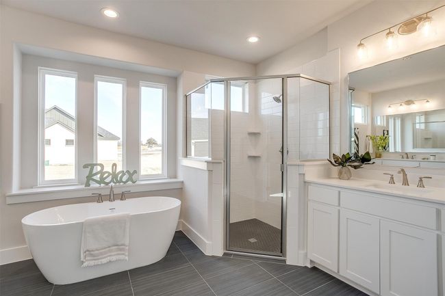 Bathroom featuring tile patterned floors, vanity, and independent shower and bath | Image 23