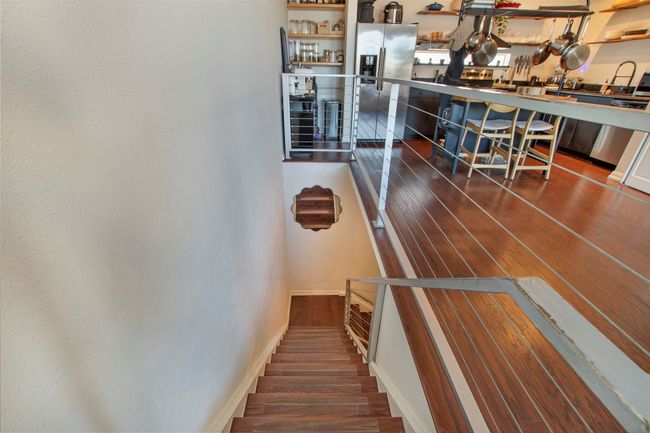 Stairs featuring wood finished floors | Image 11