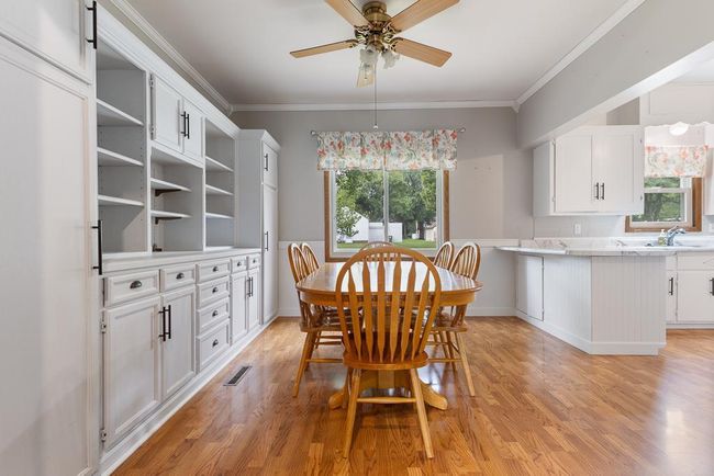 Charming dining room with cabinetry for storage and display | Image 17