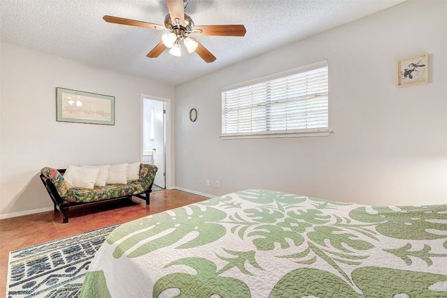 Bedroom with baseboards, a ceiling fan, and a textured ceiling | Image 25