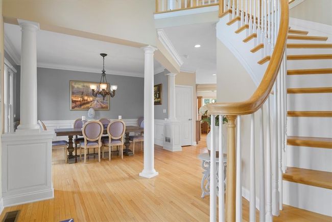Columns contribute to the elegance of the formal dining room situated to the left of the entrance. | Image 6