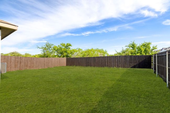 View of yard featuring a fenced backyard | Image 29