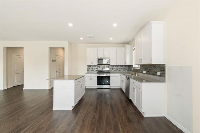 Beautiful Granite kitchen with white cabinets | Image 8