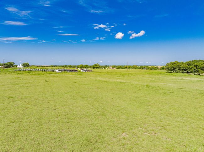 View of green lawn featuring a view of countryside | Image 9