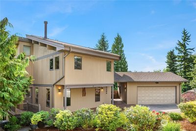 Tight grain cedar siding & a 50 year Grand Sequoia Lifetime Architectural Shingle Roof | Image 1