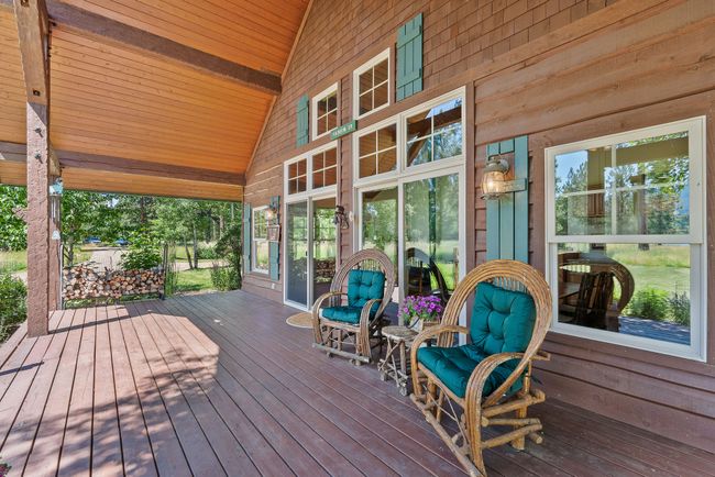 Expansive, Covered Front Porch with Serene River Views | Image 7