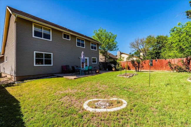 Back of house with a patio. | Image 24