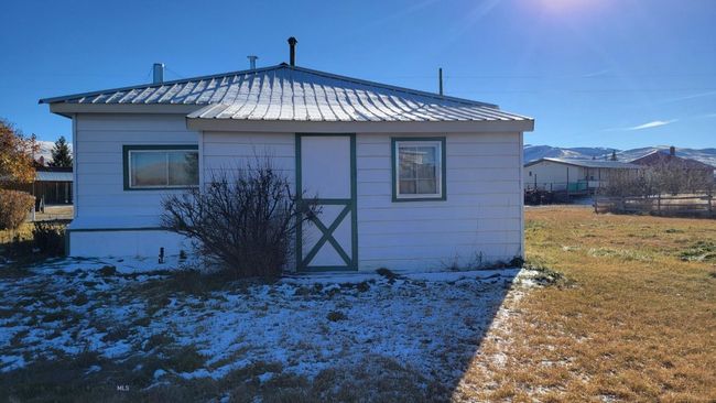 Back of house with a yard and a shed | Image 16