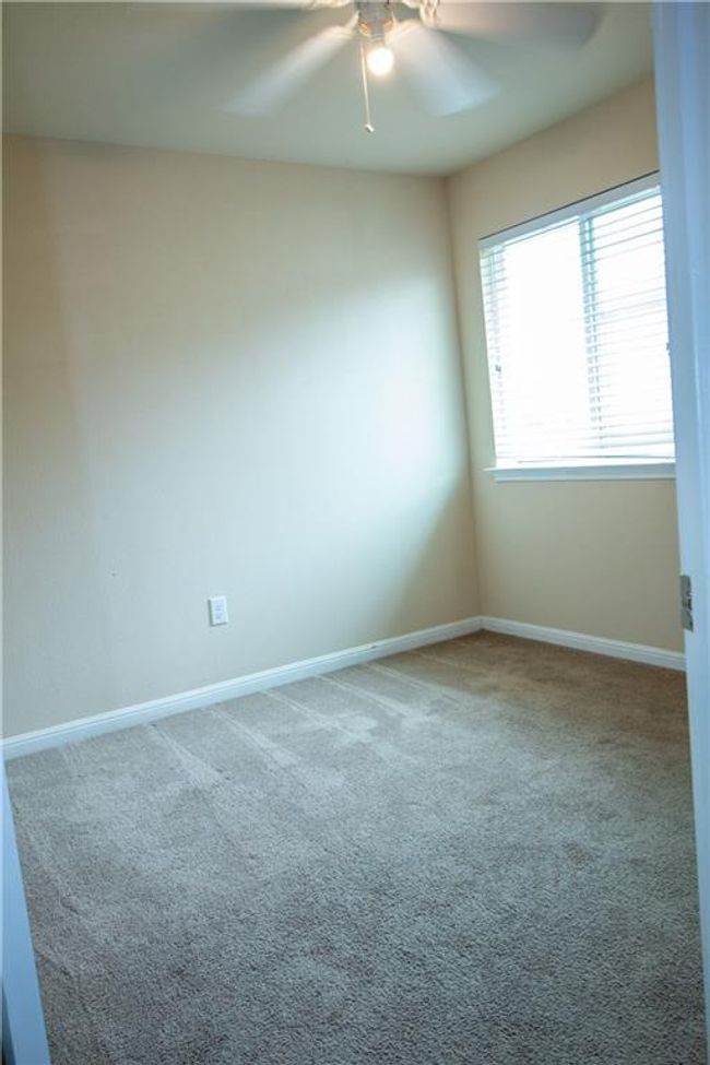 Spare room with a ceiling fan and carpet | Image 18