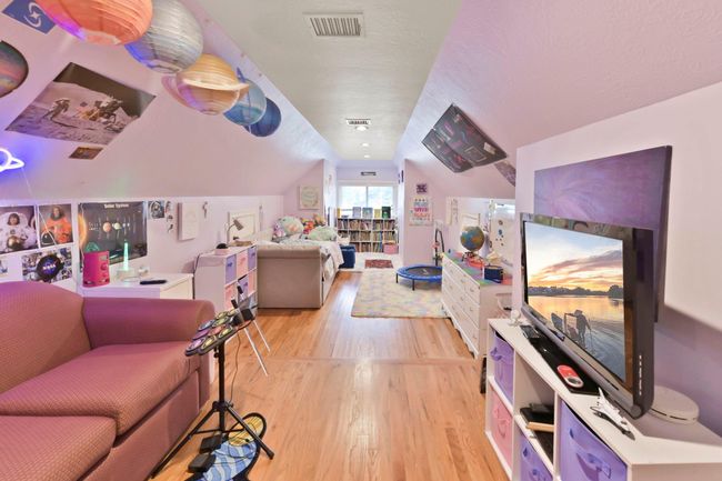 Discover the versatile bonus room over the garage, perfect as a bedroom, fitness area, or media room. | Image 37