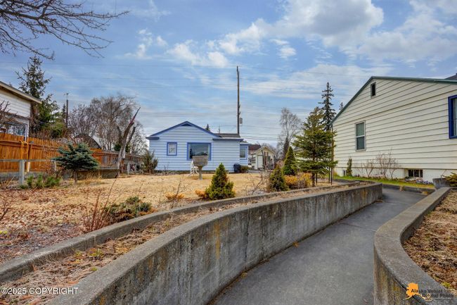 Curved Walkway With Raised Flower Beds | Image 4