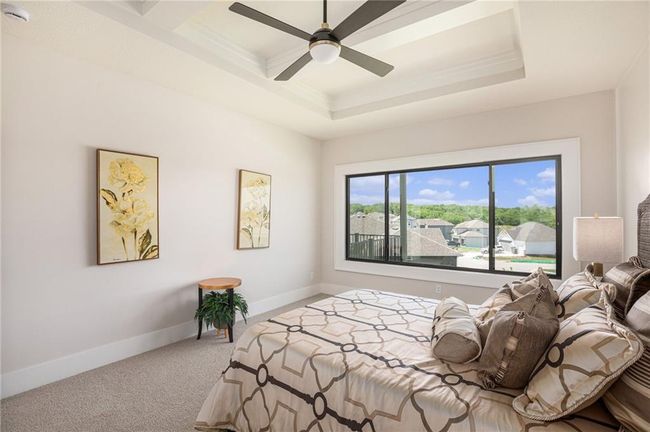 Bedroom with carpet flooring, ornamental molding, and a ceiling fan | Image 16