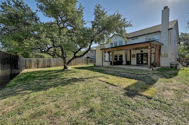 Fenced backyard with french doors and a patio | Image 30