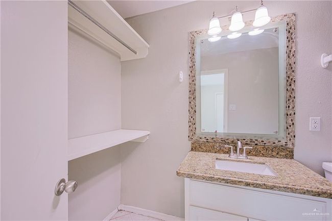 Bathroom with toilet and vanity | Image 16