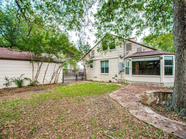 Rear view of house featuring fence and a sunroom | Image 23