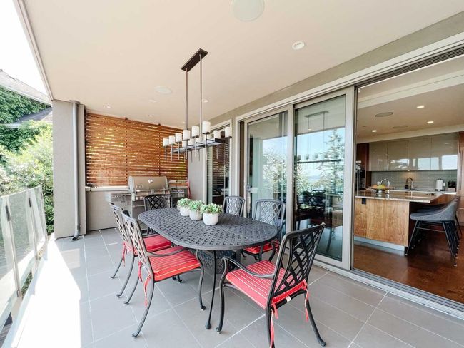 Dining area with a chandelier, light tile patterned floors, and recessed lighting | Image 18