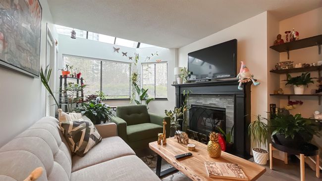 Living room featuring a fireplace | Image 10