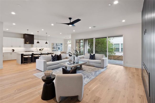 Another view of the open living area kitchen and dining room | Image 8
