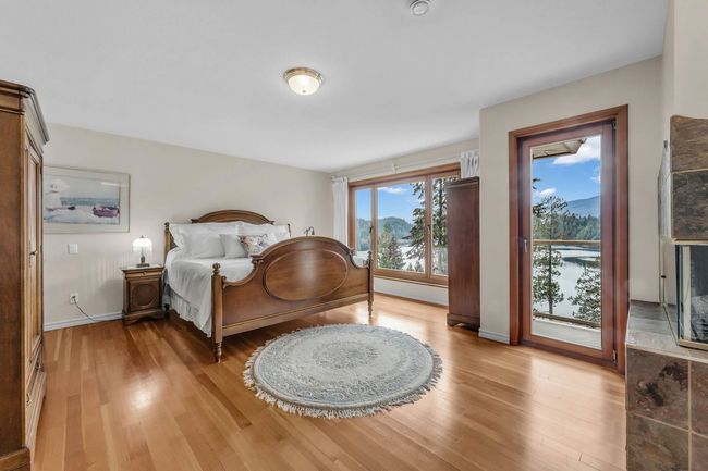 Bedroom with baseboards, access to outside, and light wood-style flooring | Image 25