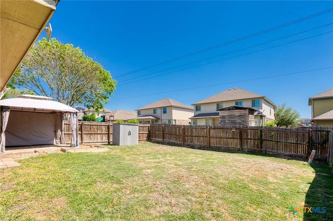 back yard showing storage shed | Image 18
