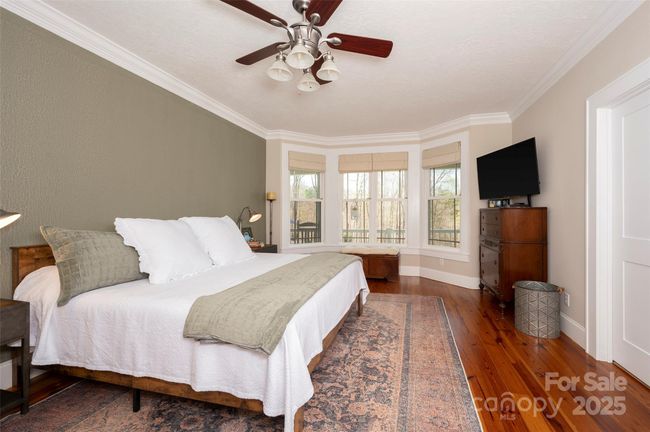 Main Level Primary Suite overlooks fenced backyard | Image 19