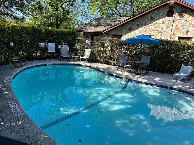 Community pool with a patio area | Image 12