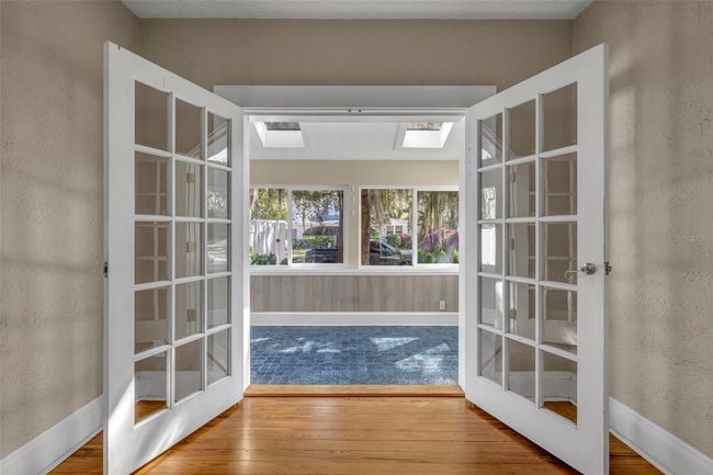 French doors open to side sunroom | Image 12