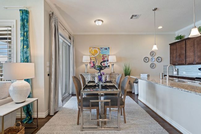 2nd Floor Dining space with ornamental molding, dark wood-style flooring, visible vents, and baseboards | Image 9