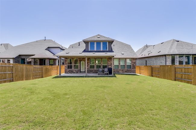 Rear view of house with a patio and brick siding | Image 36