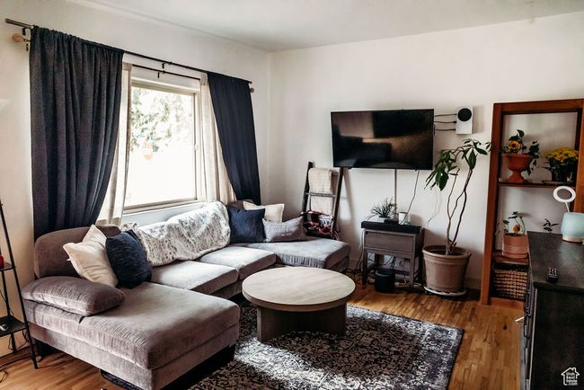 Living room with wood finished floors | Image 7