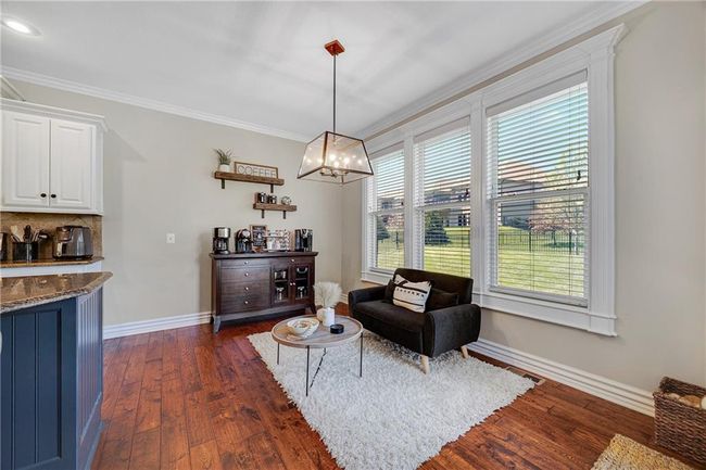 Breakfast area in the kitchen leading to the patio area. | Image 13